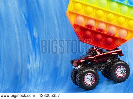 Sillicone Antistress Toy. The Car Is Carrying A Toy.