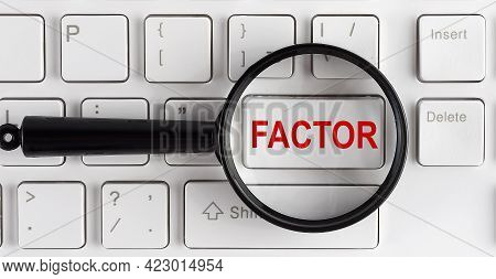 Computer Keyboard With Word Fator On The White Button, Closeup