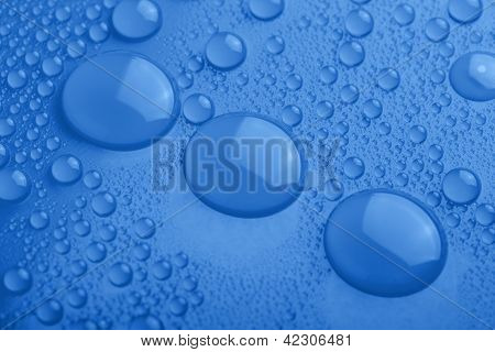 Water Drops On Blue Background