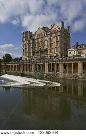 Bath, United Kingdom - June 8, 2021: Historic Buildings Line The River Avon As It Passes Through The