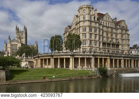 Bath, United Kingdom - June 8, 2021: Historic Buildings Line The River Avon As It Passes Through The