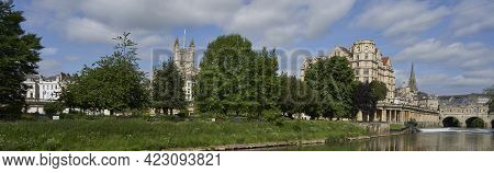 Bath, United Kingdom - June 8, 2021: Historic Buildings Line The River Avon As It Passes Through The