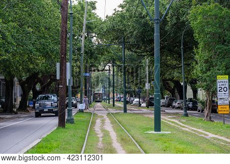 New Orleans, La - May 24: St. Traffic And Streetcar On Charles Avenue Near The Riverbend On May 24, 