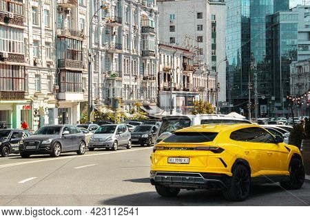 Kiev, Ukraine - May 22, 2021: Yellow Luxury Super Suv Lamborghini Urus In The City. Lamborghini Urus