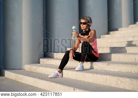 Active Seniors Woman Finish Fitness Workout In The City