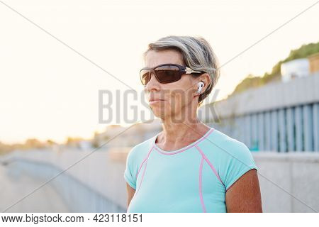 Active Seniors Woman Listen Music After Fitness Workout In The City