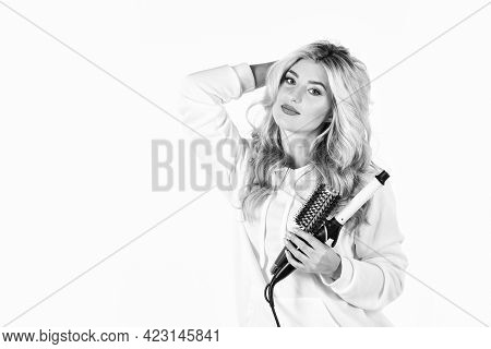 Hairstyle And Hairdressing. Girl Curling Long Hair With Curler. Girl Care About Her Hairstyle. Woman