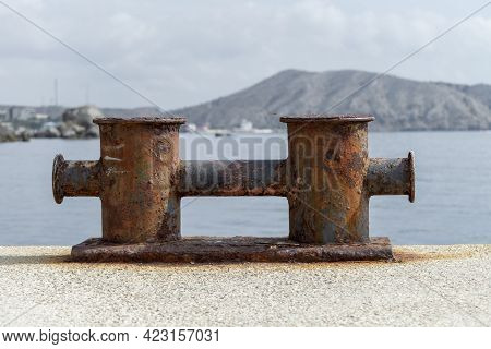 Knechts On Pier Against Backdrop Of Sea And Mountains.