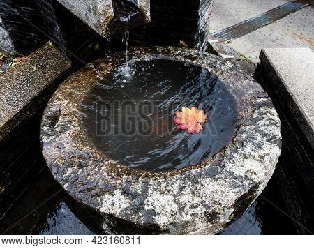 Stone Water Basin With Red Maple Leaf In Historic Downtown Of Kiso-fukushima - Nagano Prefecture, Ja