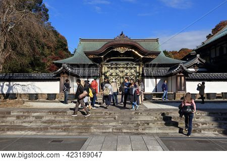 Kamakura, Japan - December 3, 2016: Tourists Visit Karamon Gate Of Kenchoji Temple In Kamakura, Japa