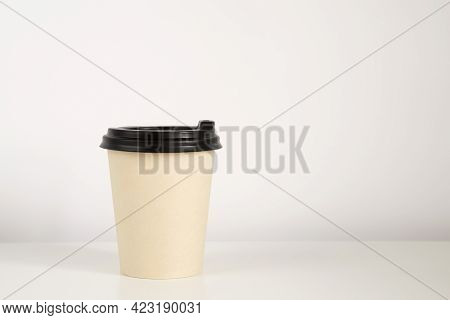 Coffee Cup Mockup On The White Background. Empty Cup On The Table With Copy Space.