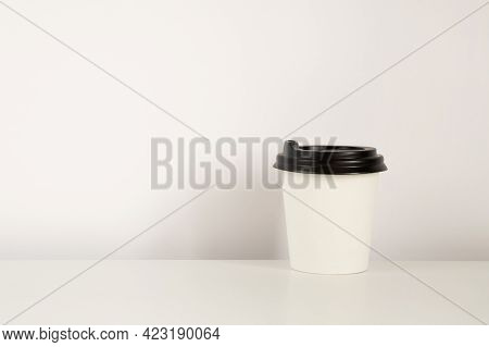 Coffee Cup Mockup On The White Background. Empty Cup For Americano On The Table With Copy Space.