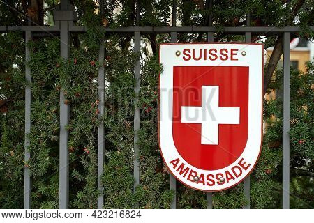 Warsaw, Poland, Nov 15, 2018: Swiss Coat Of Arms On The Swiss Embassy Fence
