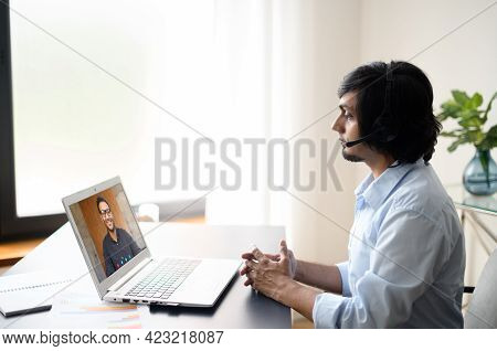 Two Indian Male Office Employee Talking Online Via Video Connect On The Laptop, Business Partners Di