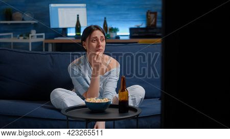 Sad Woman Crying While Watching Drama Movie On Tv Sitting Sofa Eating Popcorn. Sensitive Person Affe