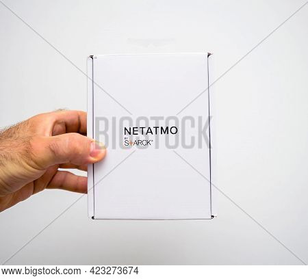 Paris, France - Apr 21, 2021: Pov Male Hand Holding New Netatmo Radiator Thermostatic Valve By Phili