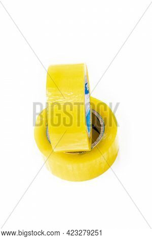 Studio Lighting. The Background Is White. Yellow Scotch Tape. Close-up