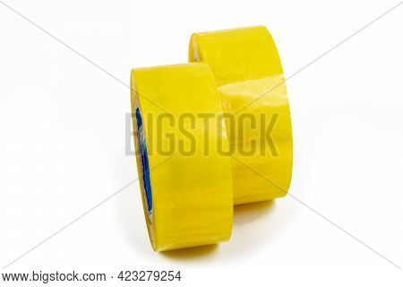 Studio Lighting. The Background Is White. Yellow Scotch Tape. Close-up