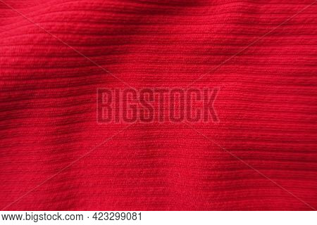 Surface Of Bright Red Ribbed Polyamide Fabric From Above