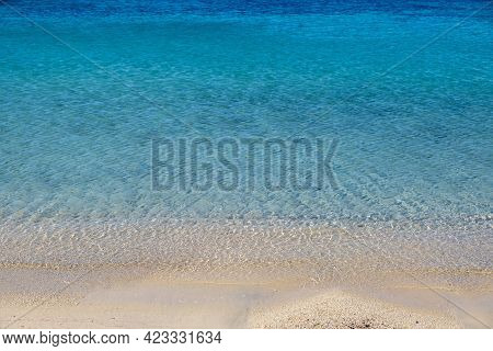 Sandy Beach, Ocean Sea Water Touches Wet Sand, Summer Vacations Concept