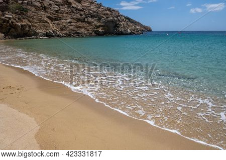 Sandy Beach, Ocean Sea Water Touches Wet Sand, Summer Vacations Concept