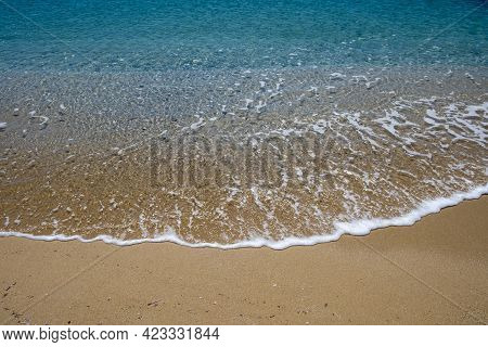 Sandy Beach, Ocean Sea Water Touches Wet Sand, Summer Vacations Concept