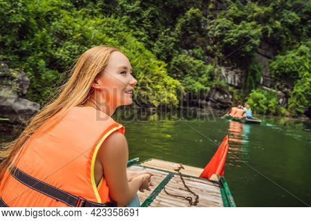 Woman Tourist In Trang An Scenic Landscape Complex In Ninh Binh Province, Vietnam A Unesco World Her