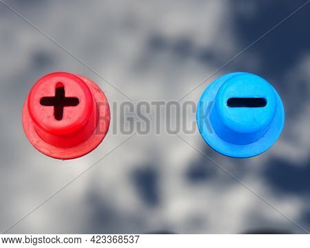 Plus And Minus. Red Positive And Blue Negative Sign. Two Opposite Poles
