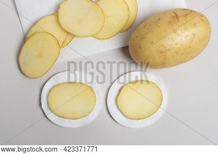Sliced Potatoes Prepared For Cosmetic Procedures. Potatoes - An Amazing Beauty Ingredient. Homemade 