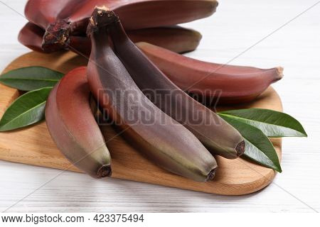Tasty Red Baby Bananas On White Table, Closeup