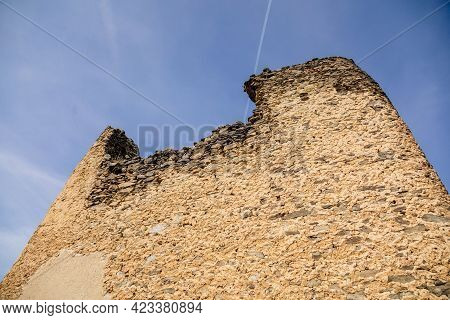 Medieval Gothic Castle Kostomlaty Or Sukoslav Under Snow, Grey Stone Ruin On Hill At Sunny Winter Da
