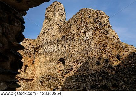 Medieval Gothic Castle Kostomlaty Or Sukoslav Under Snow, Grey Stone Ruin On Hill At Sunny Winter Da