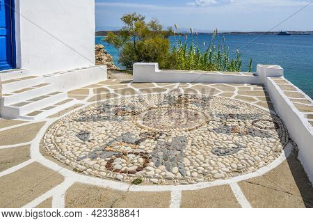 Decorative Greek Pebble Mosaic And Sea View. The Church Of Agios Ioannis Detis On Paros. Cyclades Is