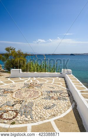 Terrace With Traditional Greek Pebble Mosaic And Sea View. Paros. Cyclades Islands, Greece
