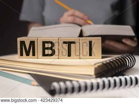 Mbti Acronym, Word On Wood Blocks On Desk With Books. Psychological Study And Research Concept.