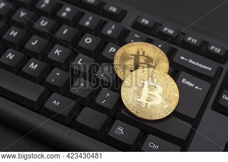 Gold Bitcoins On Computer Keyboard Close Up. Electronic Virtual Money And Mining Cryptocurrency Conc