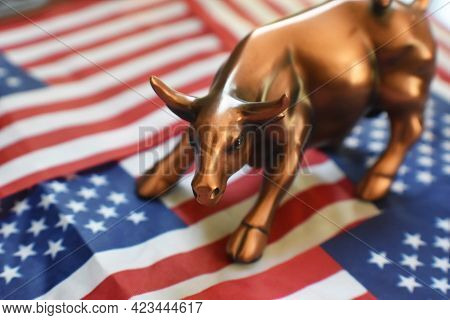 Bull Market Concept With Stock Market Bull On The American Flag