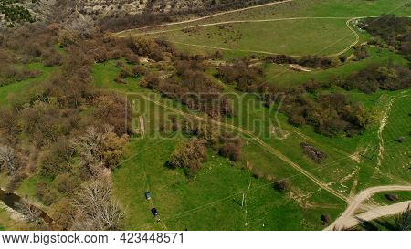 Aerial View Of A Summer Scenery With Green Pasture Fields And Bushes With Trees. Shot. Countryside N