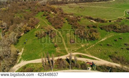 Aerial View Of A Summer Scenery With Green Pasture Fields And Bushes With Trees. Shot. Countryside N