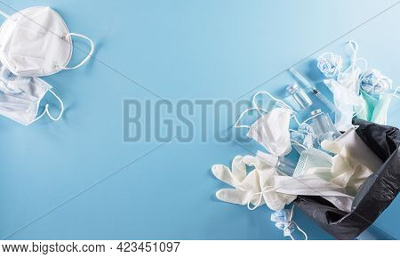 Covid-19 Plastic Waste And Garbage, Disposable Masks, Medicl Glove, Alcohol Gel Bottle And Needle In