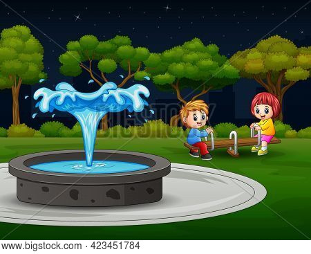 Happy Children Playing Seesaw Near The Fountain