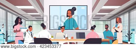 Team Of Doctors Having Video Conference Mix Race Medical Professionals Discussing At Round Table Med