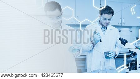 Composition of male scientists holding beaker test tubes with copy space. science and research concept digitally generated image.
