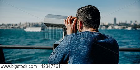 Turkish Guy Looks At The Panorama Of The City Of Istanbul