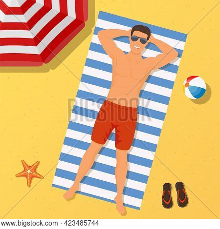 Man On The Beach. Summer Time. Man Wearing Lying On The Beach On A White And Blue Striped Towel. Guy