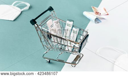 Cost Of Shnelltest, Rapid Corona Test In German Language. Shopping Cart With Covid 19 Antigen Tests 
