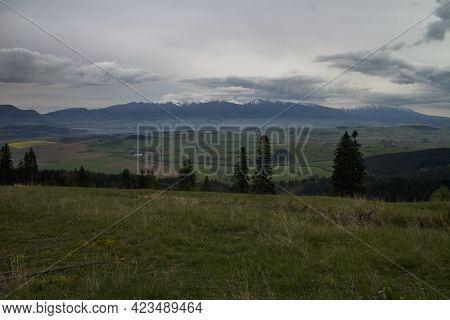 The Liptovska Mara Dam And The Western Tatras Mountains From Top Of Mountain Predna Magura.