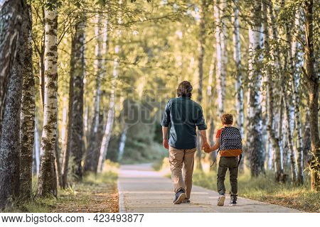 Parent And Primary School Students. The Beginning Of The Lessons. The Father Accompanies The Child T