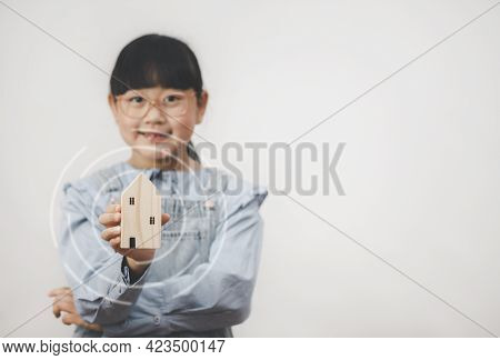 Happy Asian Girl Wear Glasses Smiling And Hand Holding Mini Home Isolation Over In The White Backgro