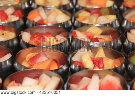 Fresh Fruit In Metal Bowls A Selfservice Cruise Ship Buffet: Melon, Pineapple And Grapes